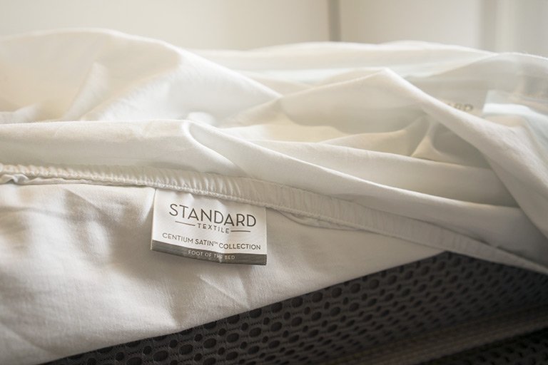 Tag that reads "foot of the bed" on the Nectar Sateen Sheets